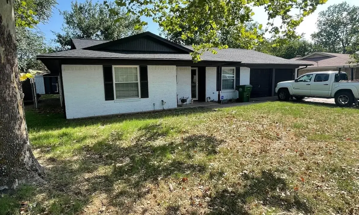 Professional roofing crew working on a residential roof in West Jordan